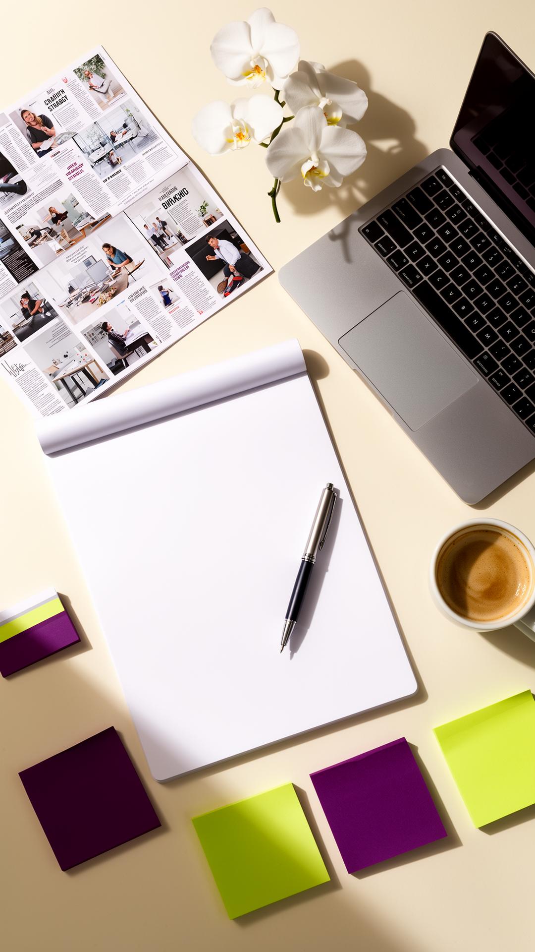 A VIP day workspace flat-lay — notepad, mood board, and color-coded sticky notes ready for breakthrough strategy
